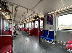 https://upload.wikimedia.org/wikipedia/commons/thumb/5/56/TTC_Line_2_T_series_Train_interior_2022.jpg/250px-TTC_Line_2_T_series_Train_interior_2022.jpg