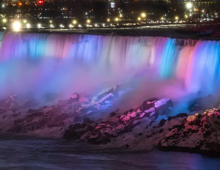 https://marvel-b1-cdn.bc0a.com/f00000000142715/www.niagaraparks.com/media/2019/12/american-falls-illuminated-pastels.jpg
